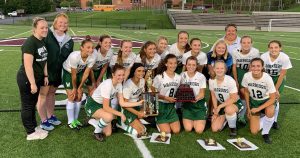 The Weedsport field hockey team poses with its trophy for winning a tournament.