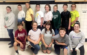 The 13 students selected for the Jr. High Band at All-County Music Festival smile for the camera 
