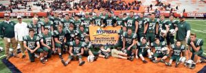 The Weedsport football team poses with its Sectional championship banner
