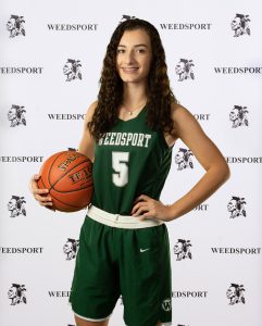 Suzie Nemec poses with a basketball