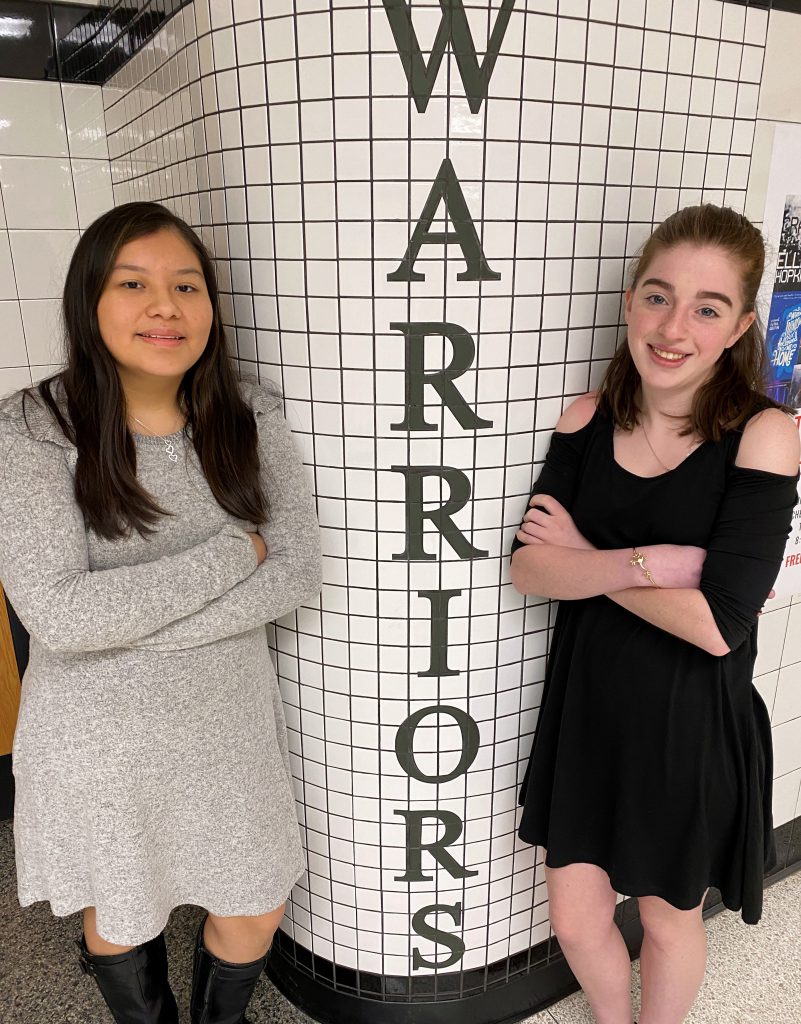 Two girls selected for Girl's State pose for the camera. 