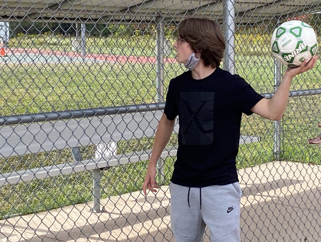 A student plays Park Golf during PE class