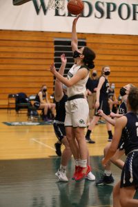 Suzie Nemec takes a shot during senior night basketball game