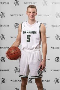 2021 Josh O'Connor poses for Weedsport Varsity Basketball team photo