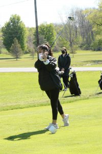 Isabella Delgado plays golf