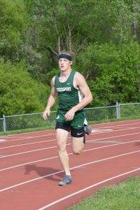 Landon Kepple runs track