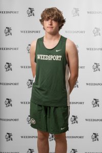 Ethan Gilfus poses for his track team photo