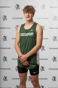 Landon Kepple poses for his track team photo