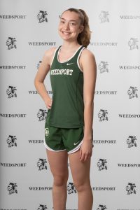 Sarah Carroll poses for her track team photo