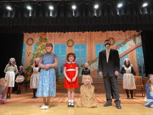 Students in grades 5-8 rehearse ahead of the opening night of Annie, Jr.