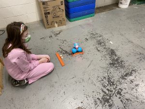 Sixth grade students learn how to code robots