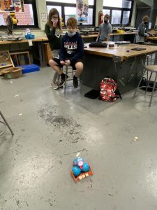 Sixth grade students learn how to code robots