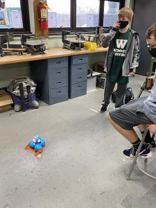 Sixth grade students learn how to code robots