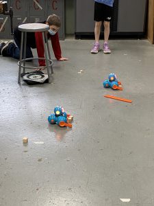 Sixth grade students learn how to code robots