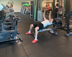 Someone lifts weights at the Fitness Center inside the Jr.-Sr. High School