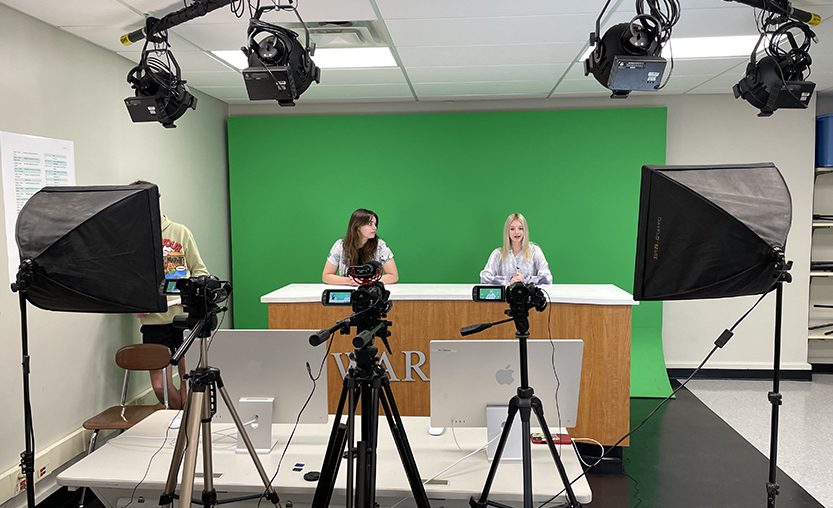 High school students anchor for Warrior TV in journalism class