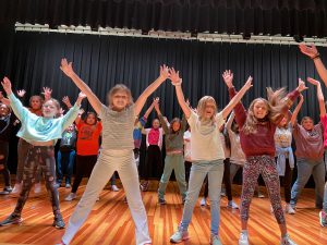 Students rehearse the 2022 middle school musical, Rudloph the Red-Nosed Reindeer
