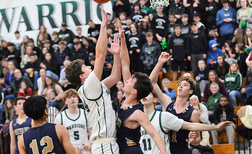 A Weedsport student shoots during a 2022 basketball game at the Jr.-Sr. High School