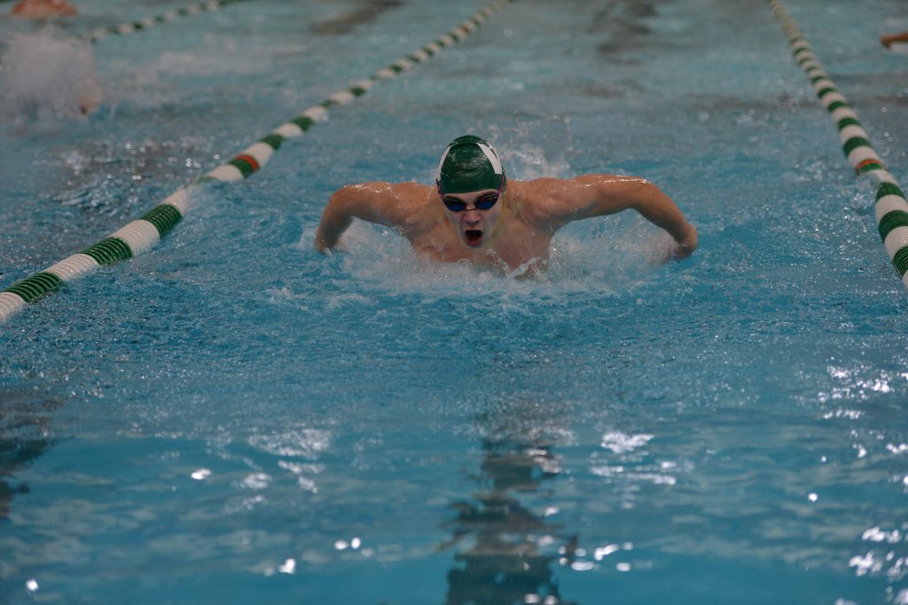 Nolan Carner comes up for air while competing at a swim meet.
