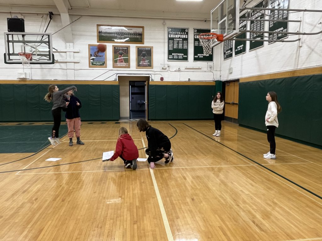 Sixth grade students participate in a Free Throw STEM Challenge in the Jr.-Sr. High School gymnasium.