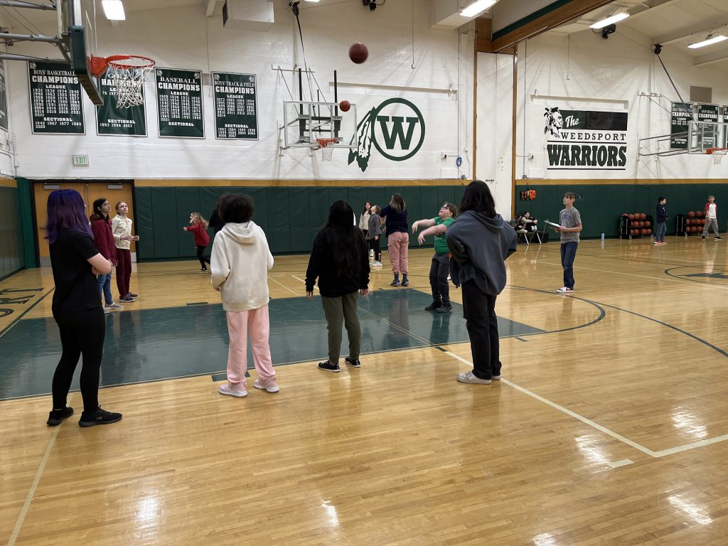 Sixth grade students participate in a Free Throw STEM Challenge in the Jr.-Sr. High School gymnasium.