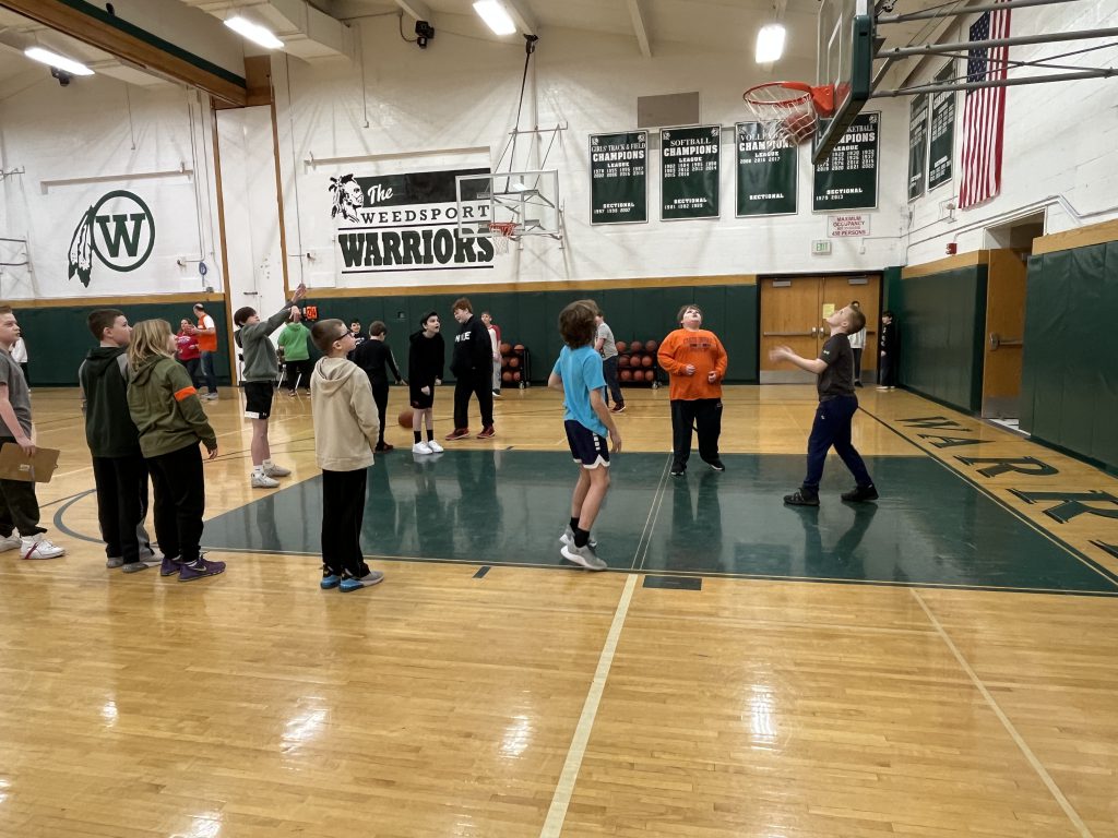 Sixth grade students participate in a Free Throw STEM Challenge in the Jr.-Sr. High School gymnasium.