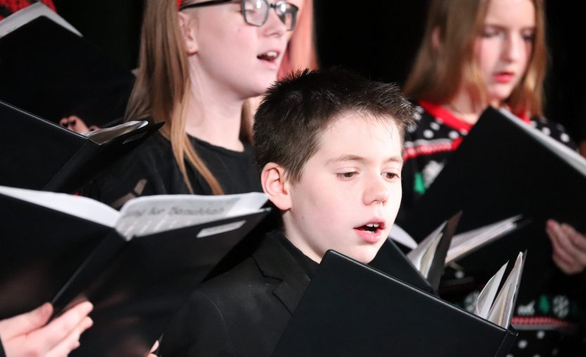 Students singing at chorus concert